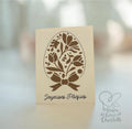 Carte de Pâques artisanale au design délicat, représentant un œuf orné de motifs floraux